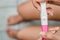 Young asian woman holding pregnancy test showing a positive result in bathroom, Wellness and healthy concept, Abortion problem,