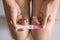 Young asian woman holding pregnancy test showing a positive result in bedroom, Wellness and healthy concept, Abortion problem,