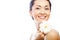 Young asian woman holding white gerber flower