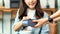 Young asian woman holdingcredit cardfor paying contactless at coffee shop, cafe background, Small business financial and