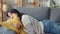 Young asian woman lay down on comfortable sofa in living room sleep after hard time work day and feel sick and bad, tired female