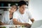 Young asian woman leaning on shoulder of handsome man. Portrait of husband and wife look at camera and smile.