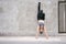 Young Asian woman make handstand upside down in the exercise. fitness athlete concept.