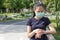 Young asian woman in medical protective mask doing setting smart watch application before exercise in the morning.working out