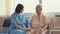 Young Asian woman nurse caregiver encourage take care her senior patient hold hand explain information use walker assistance in