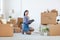 Young Asian Woman Organizing Boxes