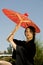 Young Asian Woman Outside with Umbrella