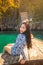 Young asian woman relax on long tail boat at Maya bay