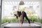 Young asian woman in relaxation stretching position on her balcony floor