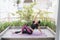 Young asian woman in relaxation stretching position on her balcony floor