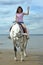 Young asian woman riding white horse