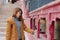 Young asian woman rotating praying wheels for religious reason at Thiksey monastery.