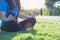 Young Asian woman sitting in yoga position and meditating. Concept of meditation, wellbeing and healthy lifestyle