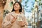 Young asian woman smiling happy counting japanese yen banknotes at the city