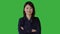 Young Asian Woman Standing Isolated on Green Screen Background