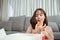Young asian woman takeaway eating donut junk food in living room enjoy happiness at home, Fast food