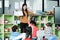 Young asian woman teacher teaching kids in kindergarten classroom, preschool education concept