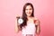 Young Asian woman with tomato juice and clock