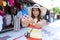 Young asian woman tourist make selfie by smartphone at street market