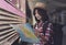 Young asian woman traveller is looking at the map at the train station, Travel and transportation concept. Traveler is waiting for