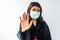 Young Asian woman using face mask with hand showing protection concept of Corona virus or Covid-19 virus