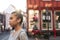 Young Asian woman walking through city streets in the afternoon