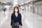 Young Asian woman wearing protection mask against Novel coronavirus or Corona Virus Disease Covid-19 at airport, is a contagious