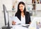 Young asian woman working in office and signs documents