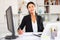 Young asian woman working in office and signs documents