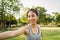 Young asian woman yoga outdoors keep calm and meditates while practicing yoga.