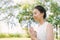 Young asian woman yoga outdoors keep calm and meditates while practicing yoga to explore the inner peace.