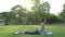 Young asian woman yoga outdoors keep calm and meditates while practicing yoga to explore the inner peace.