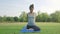 Young asian woman yoga outdoors keep calm and meditates while practicing yoga to explore the inner peace.