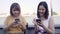 Young Asian women close friend tourist with casual enjoy with smartphone share photo in online social media in front of view port