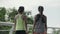 young asian women walking and chatting during outdoor exercise in park