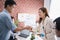 Young Asians shake hands for business partners in the office