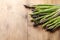 Young asparagus on wooden kitchen table. Diet food concept