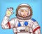 Young astronaut girl in a space suit waving her hand