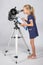 Young astronomer happy to look through the telescope recording observations