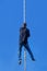 Young Athlete climbing up the Fitness rope