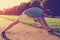 Young athlete doing warming stretching before workout in the park