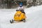 Young athlete driving a snowmobile