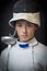 a young athlete-fencer with a sword on his shoulder