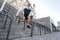 Young athlete jumping off the steps outdoors