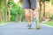 Young athlete man with running shoes in the park outdoor, male runner ready for jogging on the road outside, asian Fitness walking