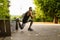 Young athlete man in sportswear doing workout in park