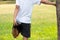 Young athlete man streching in the park outdoor. male runner warm up ready for jogging on the road outside. asian Fitness walking