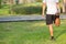 Young athlete man streching in the park outdoor. male runner warm up ready for jogging on the road outside. asian Fitness walking