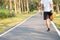 Young athlete man streching in the park outdoor. male runner warm up ready for jogging on the road outside. asian Fitness walking