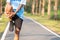 Young athlete man streching in the park outdoor. male runner warm up ready for jogging on the road outside. asian Fitness walking